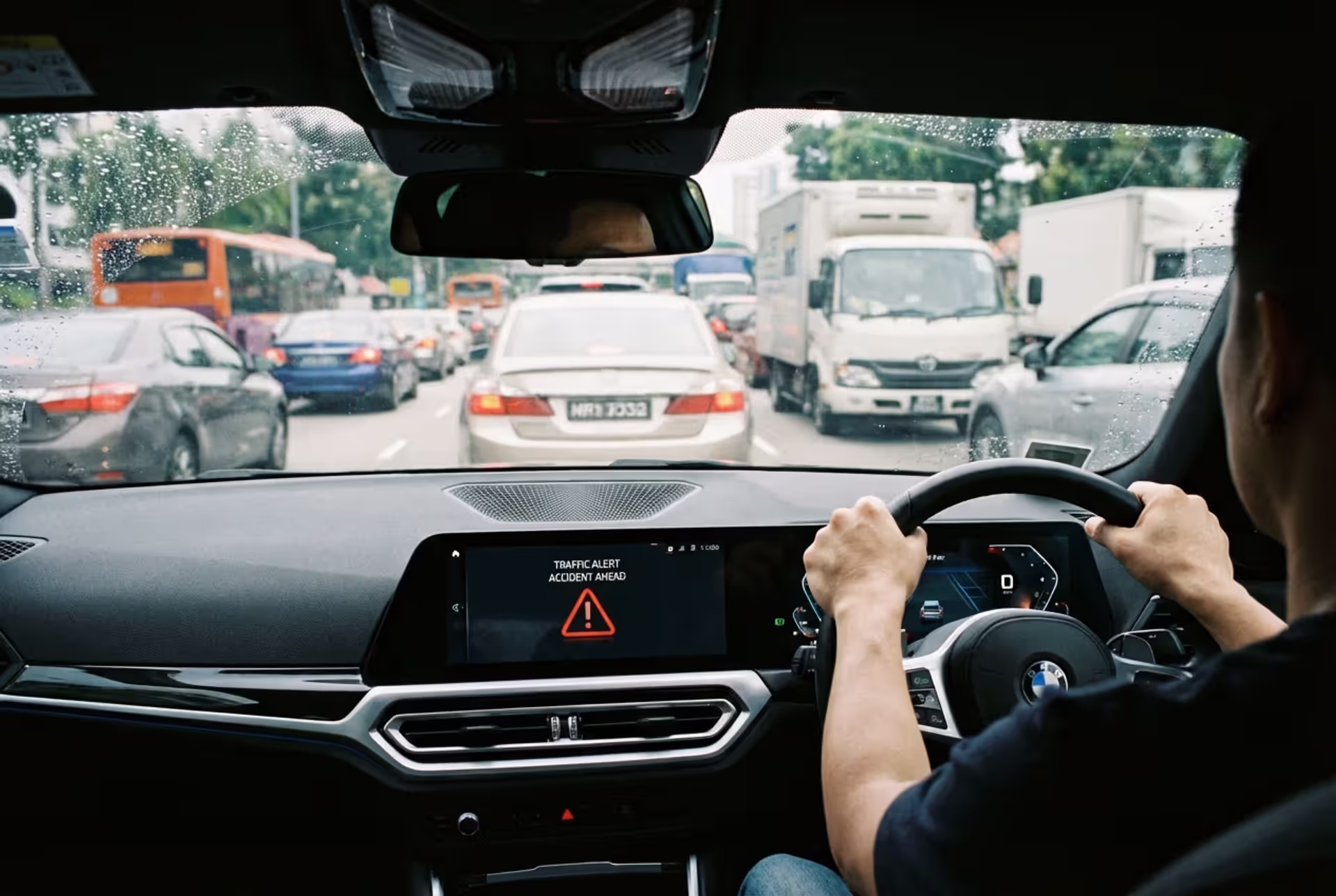 Driver behind the wheel in city traffic